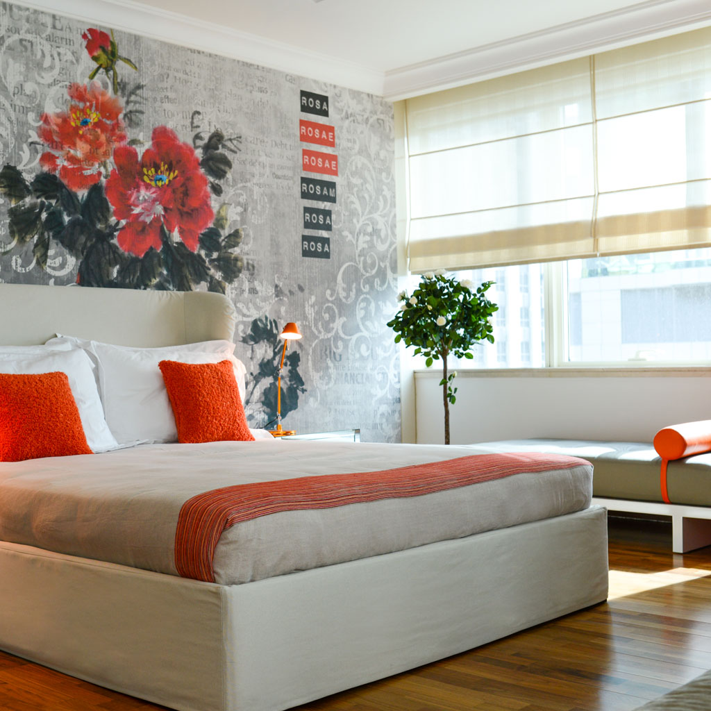 A bedroom interior with a beautiful feature wall