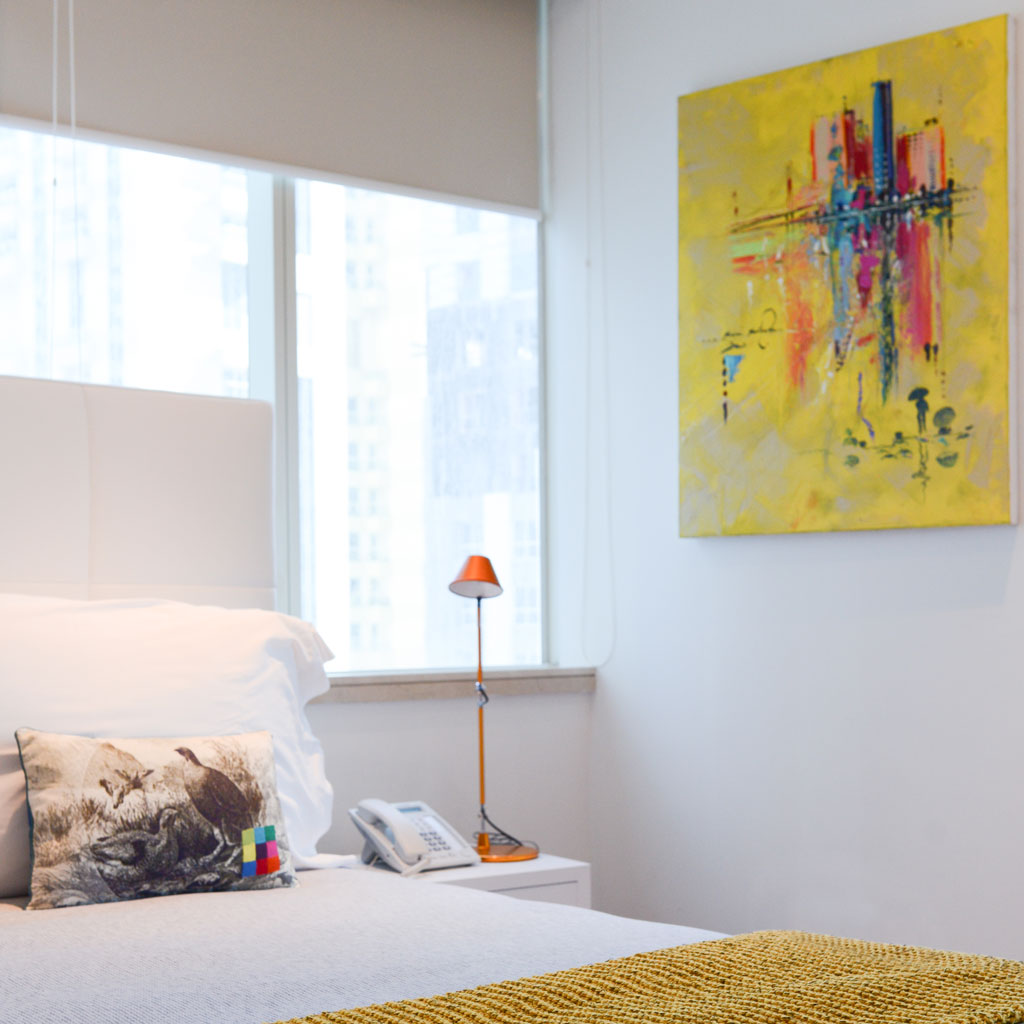 A bedroom with pop-color accents