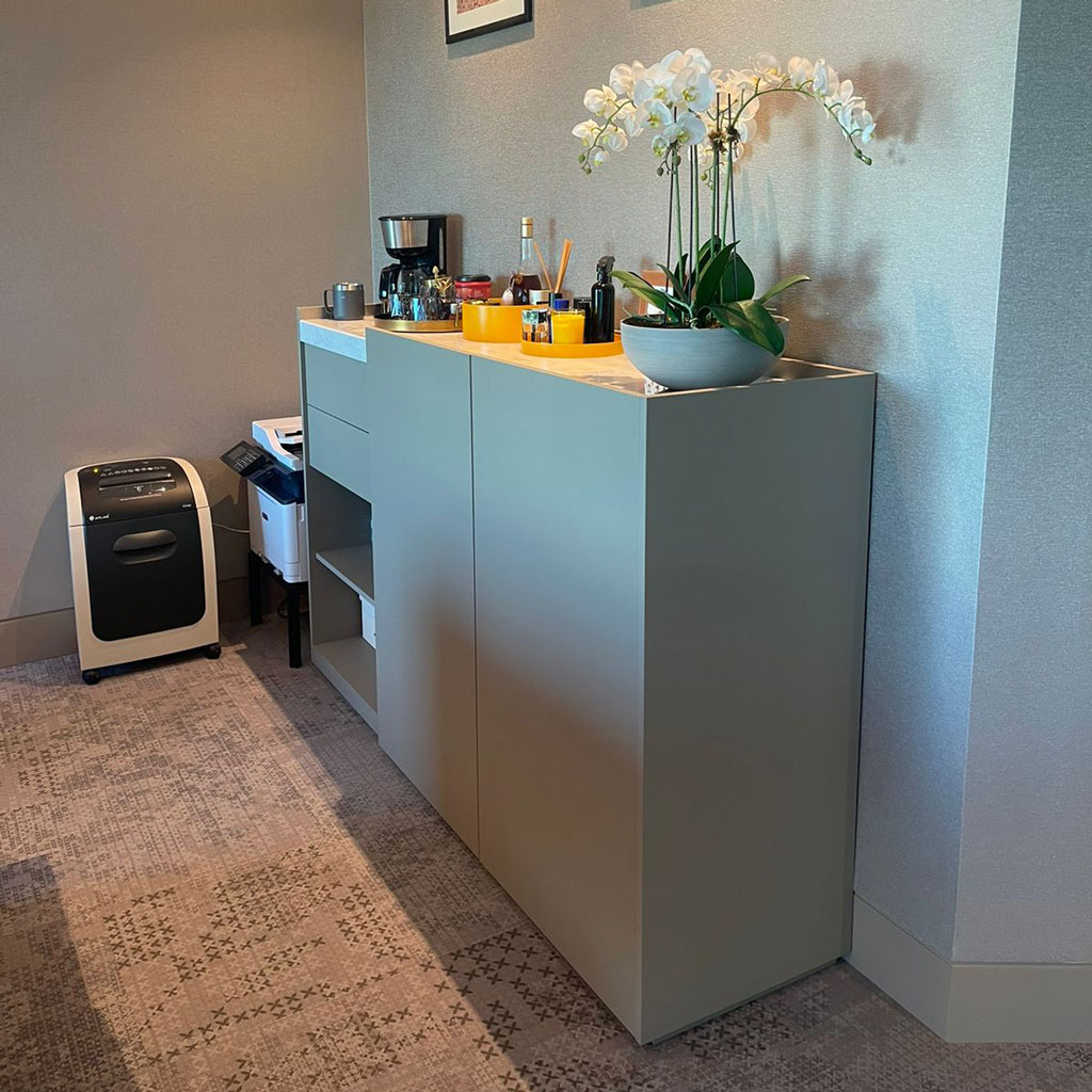 A luxurious executive desk anchors the manager's office, conveying power and status.