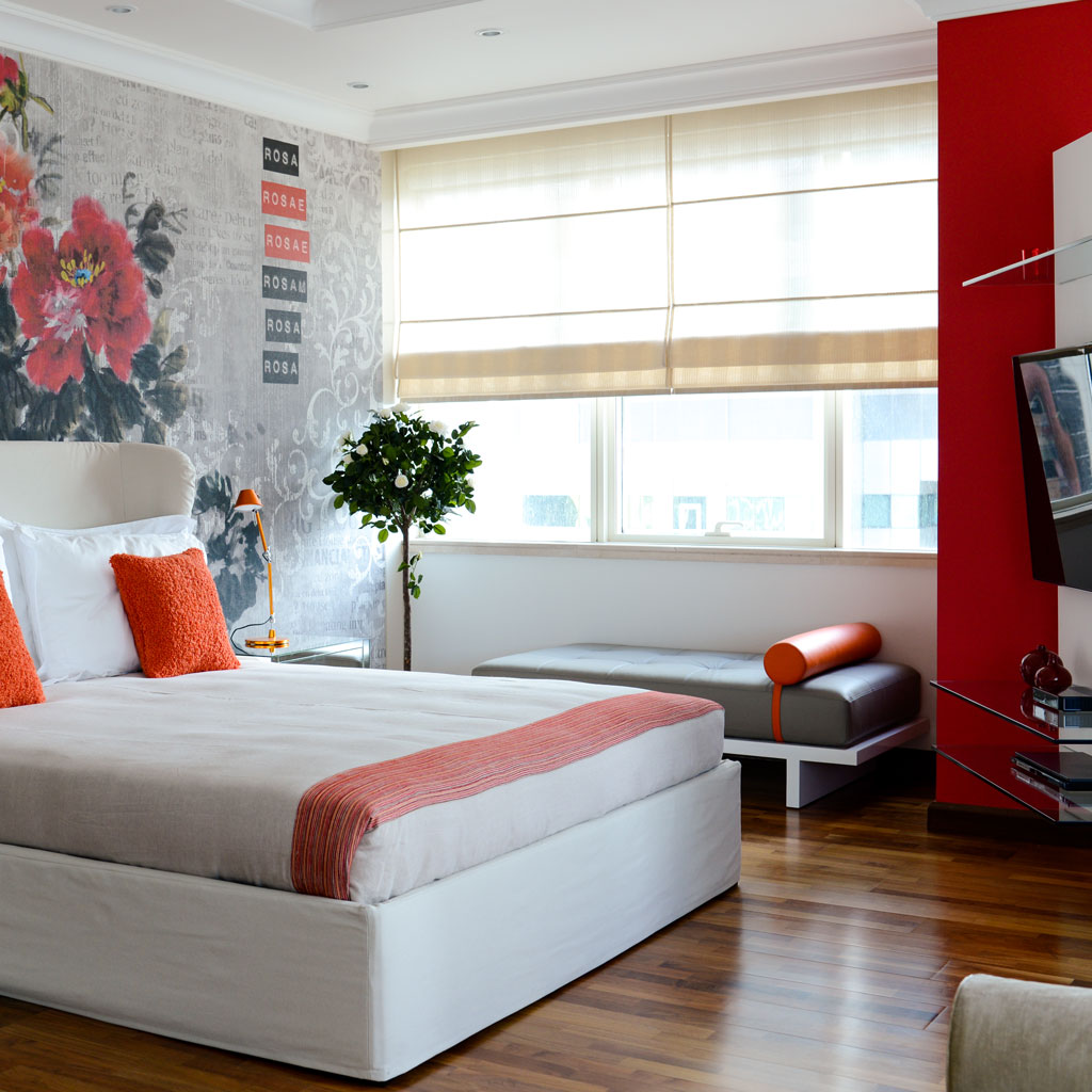 A minimalist color palette and uncluttered design create a serene atmosphere in the modern bedroom.