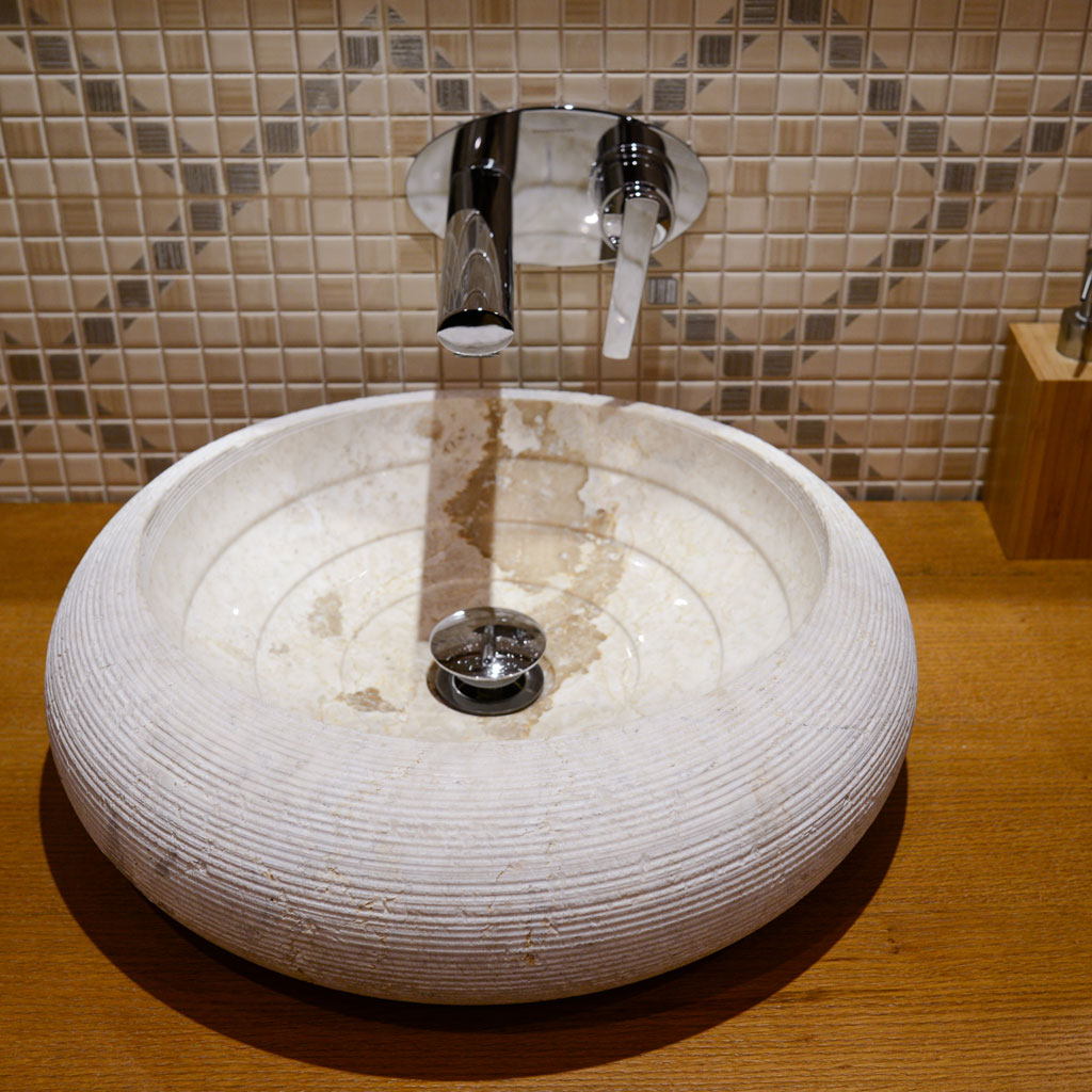 A natural stone sink for a bathroom