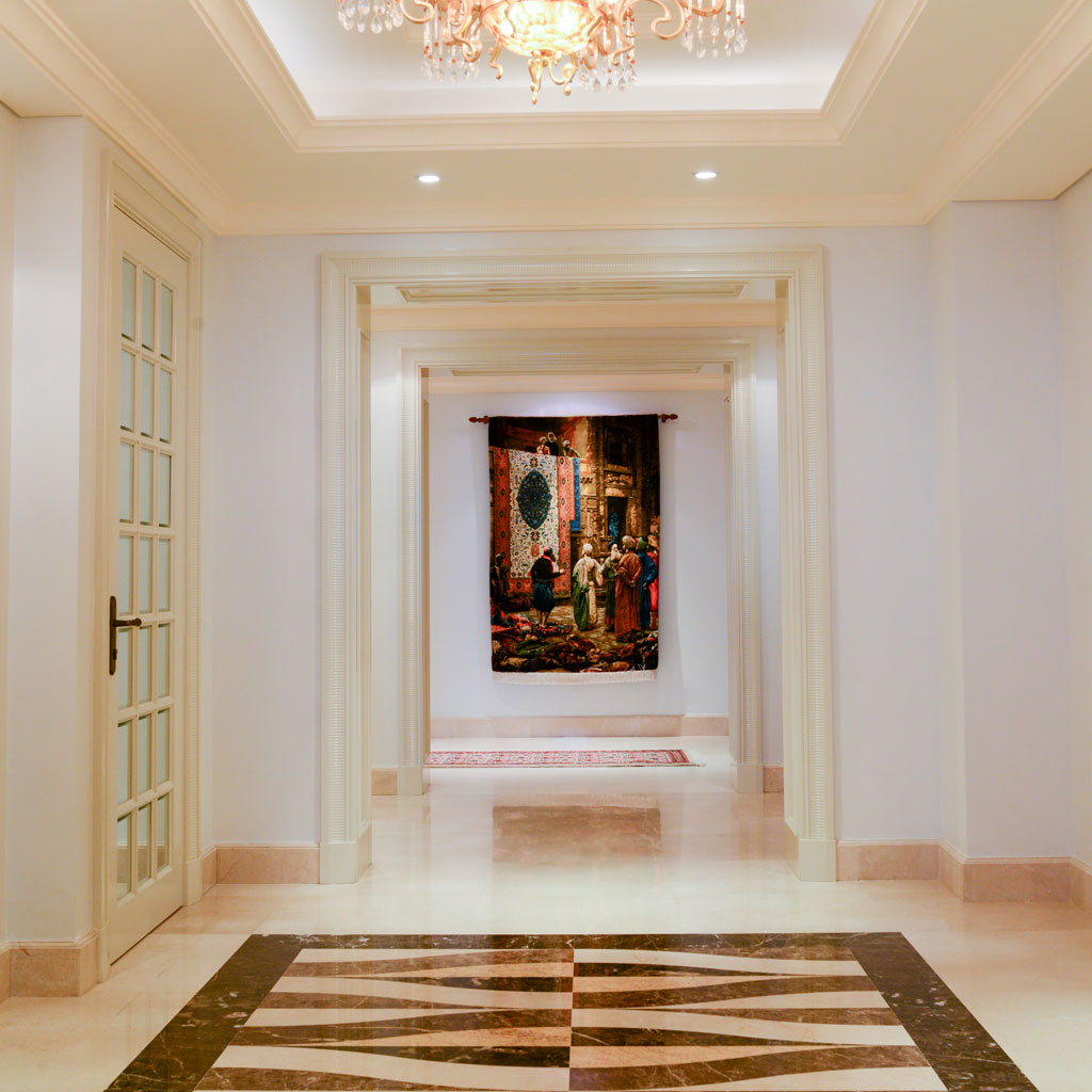 A sense of grandeur pervades the master bedroom, characterized by majestic architecture and rich fabrics.