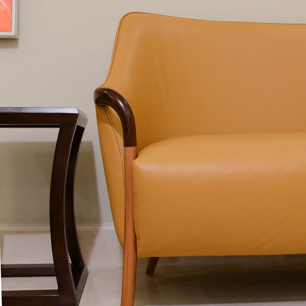 A sofa and a side table in a villa living area