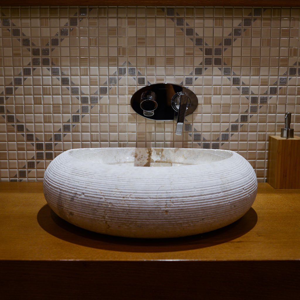 A stone sink in a bathroom