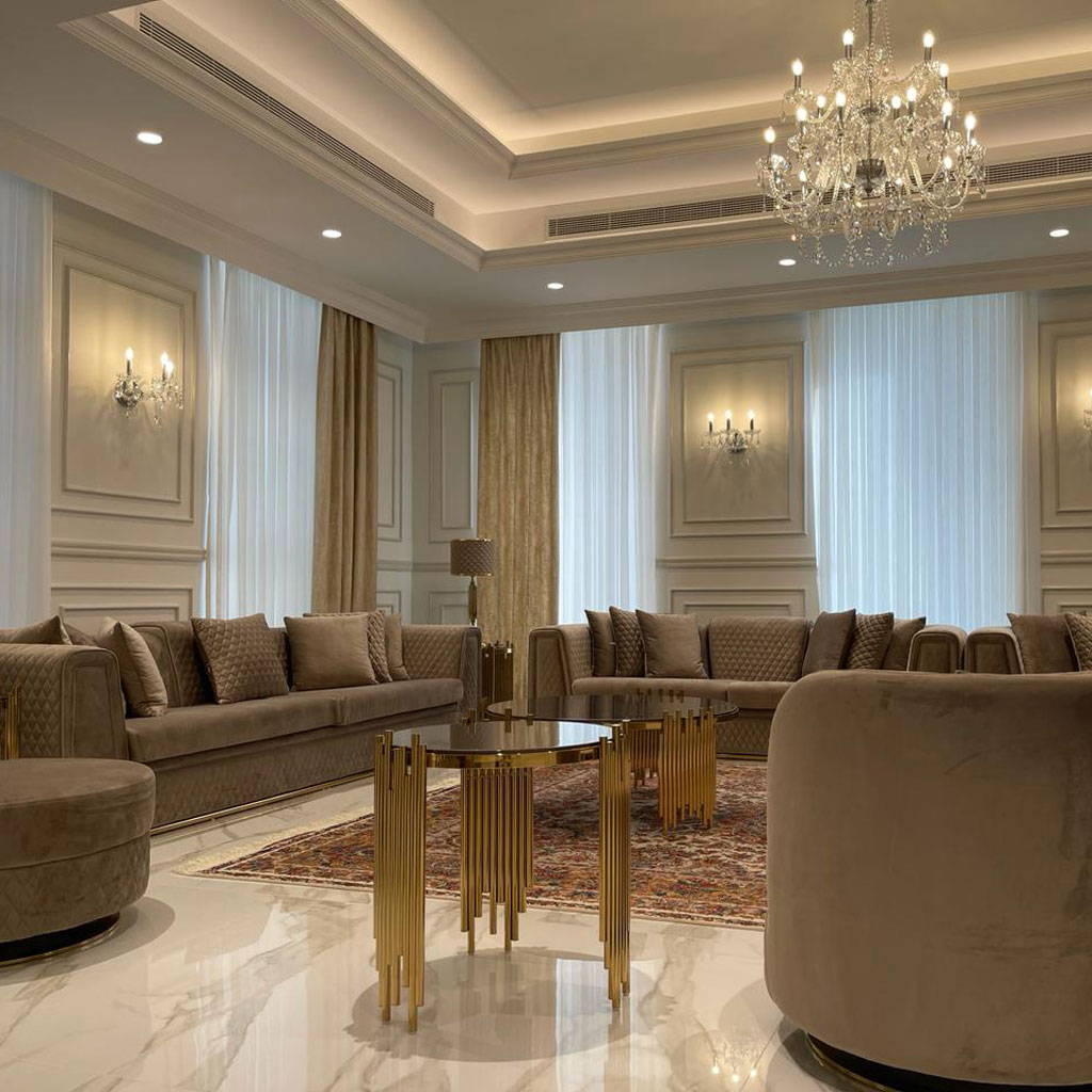 Carved wooden furniture adds warmth and sophistication to the Arabic majlis sitting.
