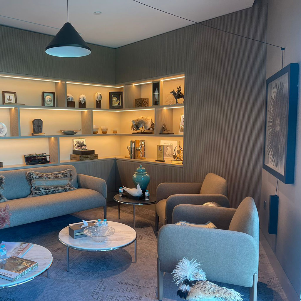 Executive amenities such as a private bar or lounge area elevate the office experience.