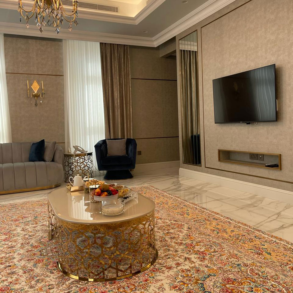 Plush cushions and rich fabrics create a luxurious seating experience in the majlis.