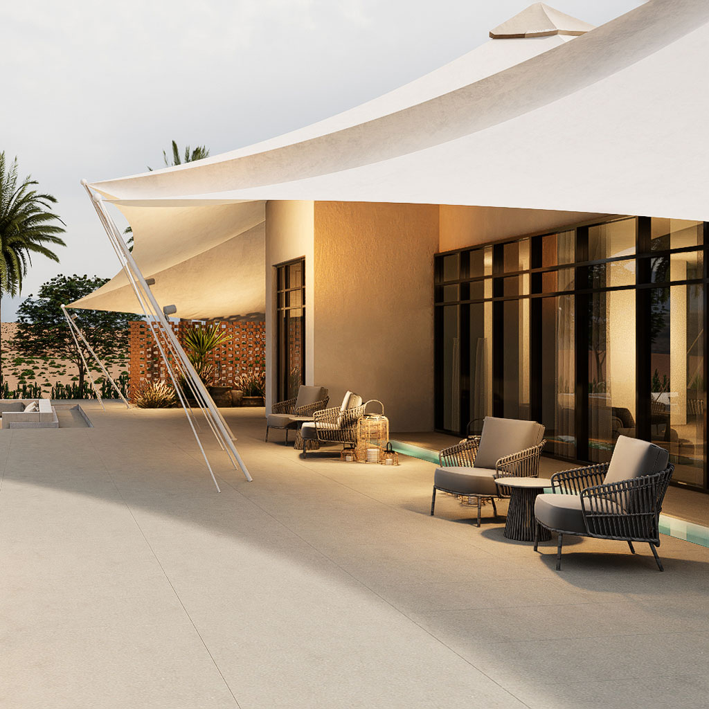 The classic design of this majlis seating includes hand-woven rugs and ornate pillows, creating a warm and inviting atmosphere.