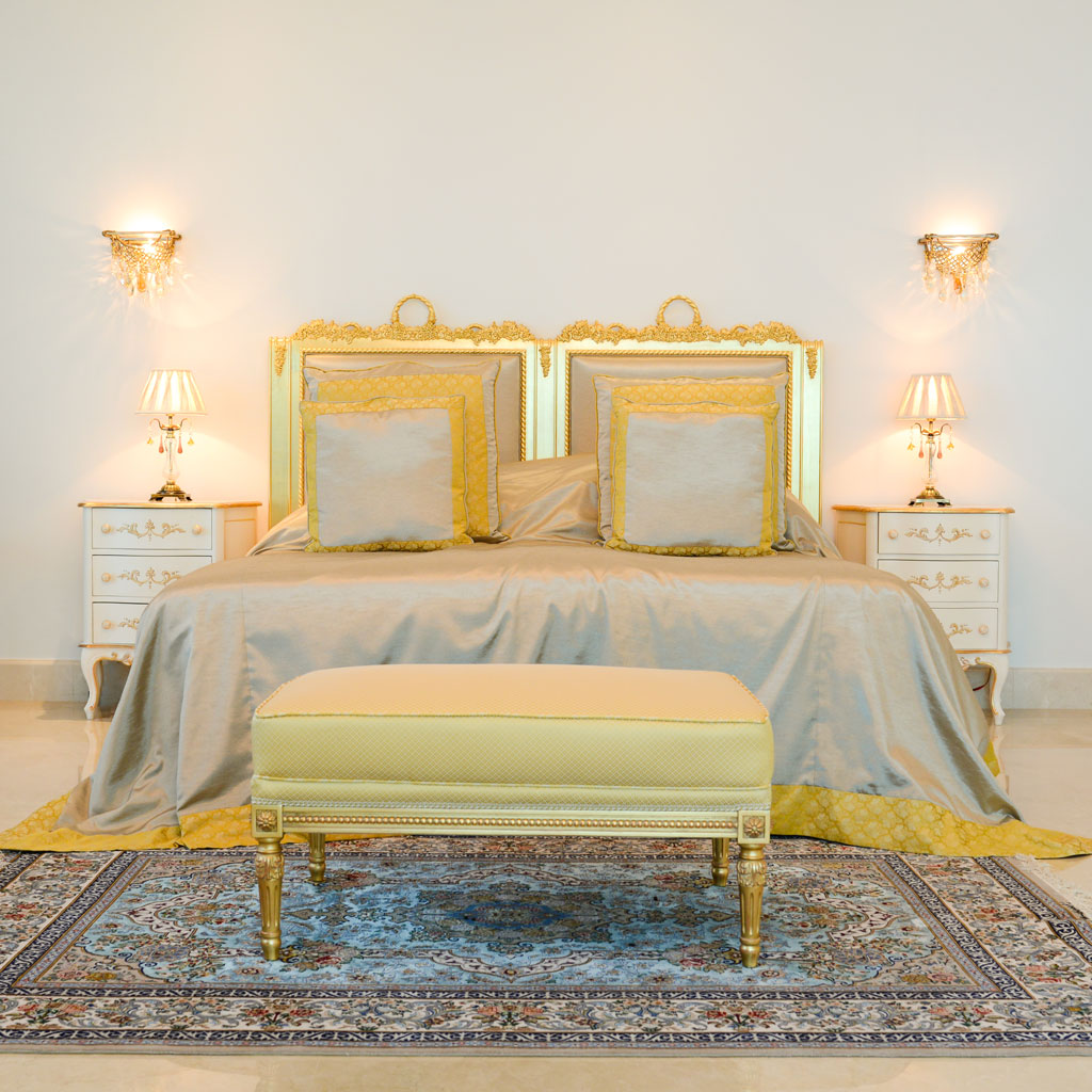 The classical luxury interior design exudes timeless elegance with its rich color palette and luxurious materials.