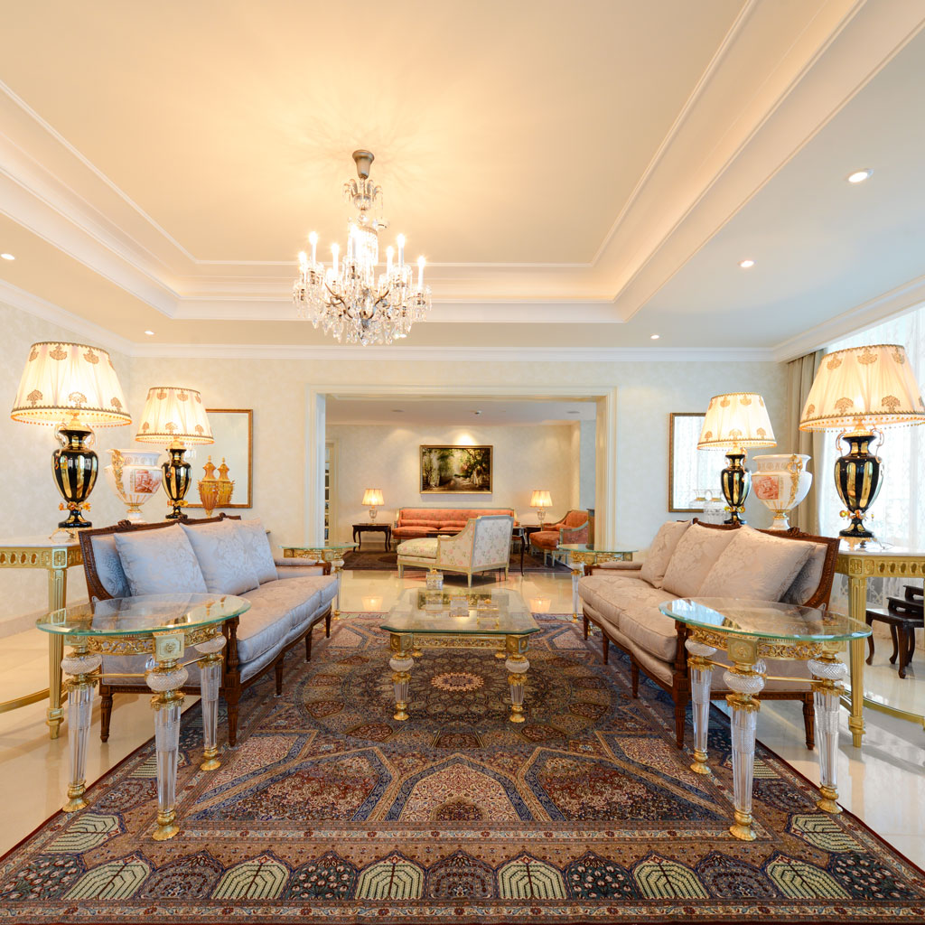 The living room exudes timeless sophistication with its classical palace-style design.