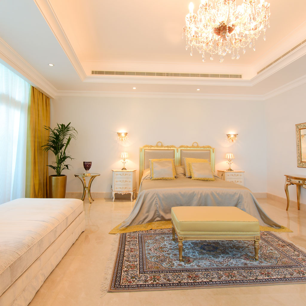 The master bedroom exudes opulence with its regal furnishings and intricate detailing.