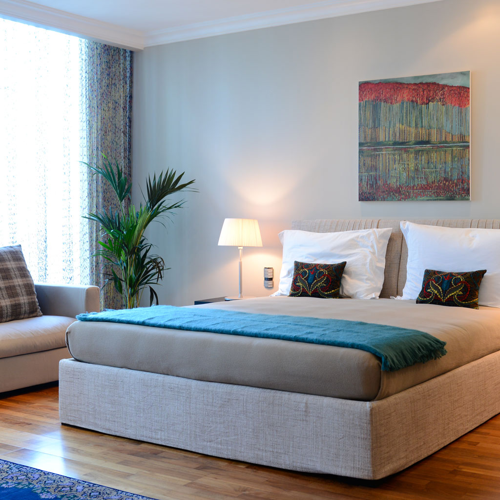 The modern bedroom exudes sophistication with its sleek furnishings and streamlined design.