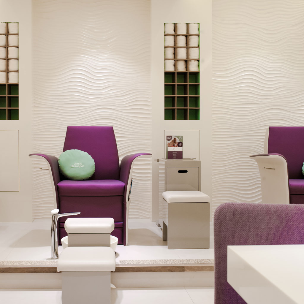 The salon's vibrant color scheme adds energy and excitement to the space.