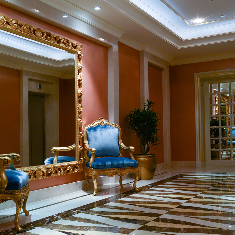 This Dubai palace's grand ballrooms, adorned with royal style armchairs and gold leaf detailing, are the pinnacle of classical elegance.