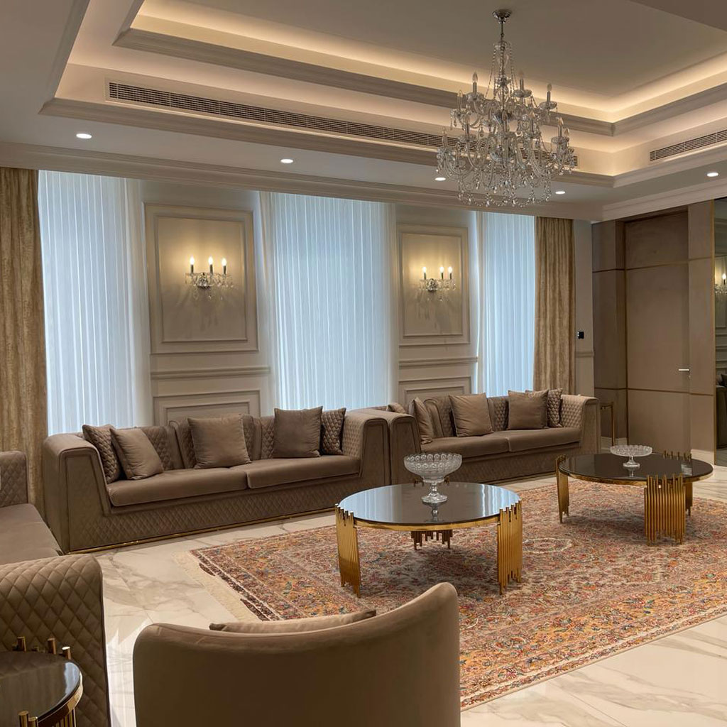 Traditional Arabic calligraphy decorates the walls, infusing the majlis with cultural charm.